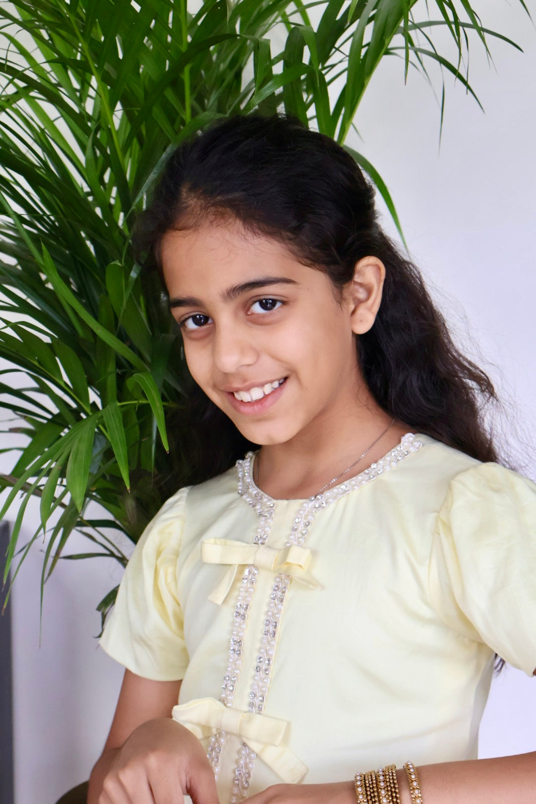 Yellow Farshi salwar suit with matching bag and hair band